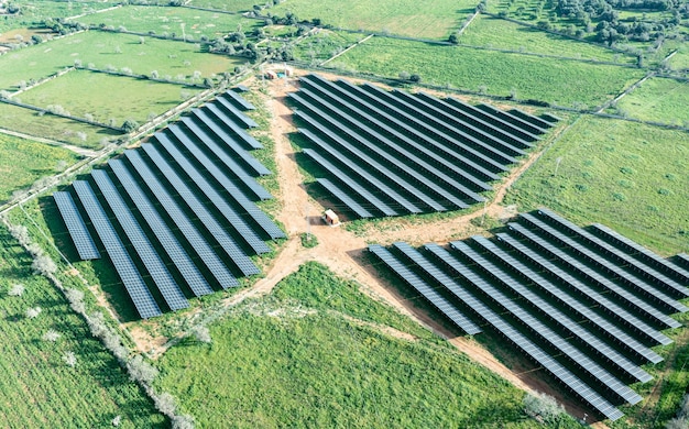 Lined up solar panels on the countryside in an aerial drone photo