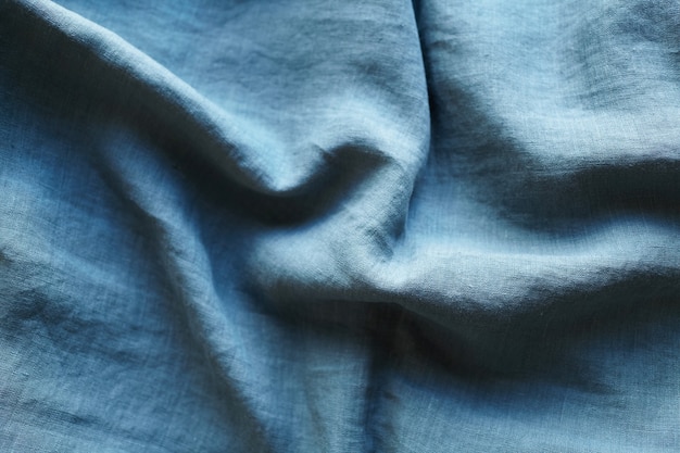 Linen fabric with pleats turquoise color texture background top view