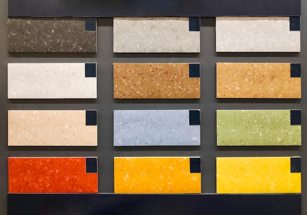 Linoleum colored samples on the wall in building materials stores flooring samples catalogue