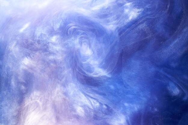 Liquid fluid art abstract background. Blue acrylic paint underwater, galactic smoke ocean