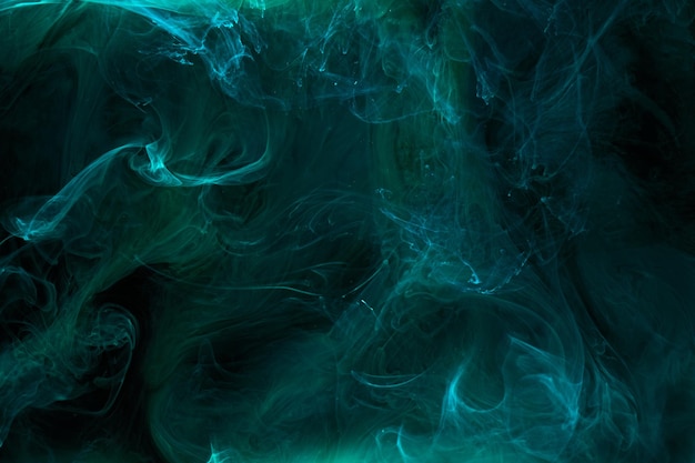 Liquid fluid art abstract background Blue green acrylic paint underwater galactic smoke ocean