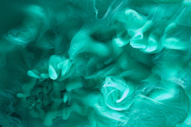 Liquid fluid art abstract background Blue green acrylic paint underwater galactic smoke ocean