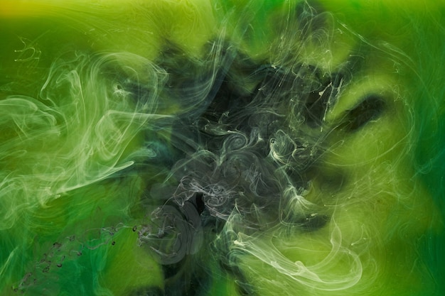 Liquid fluid art abstract background Green dancing acrylic paints underwater cosmic smoke ocean