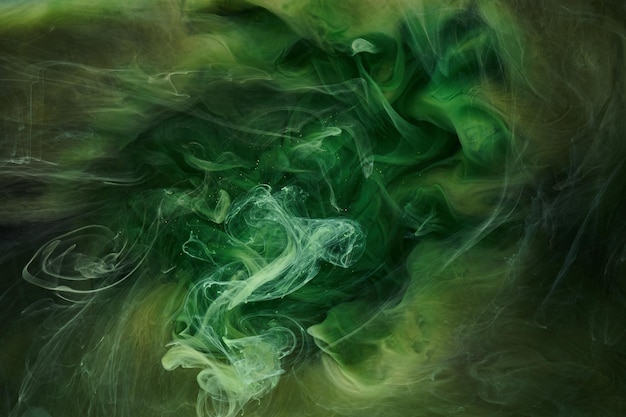 Liquid fluid art abstract background Green dancing acrylic paints underwater cosmic smoke ocean