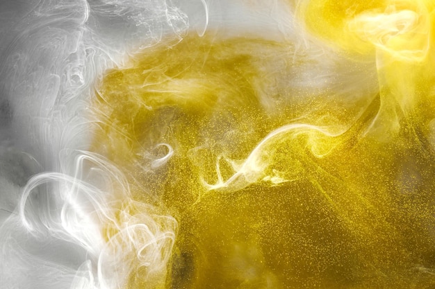 Liquid fluid art abstract background White yellow dancing acrylic paints underwater space smoke ocean