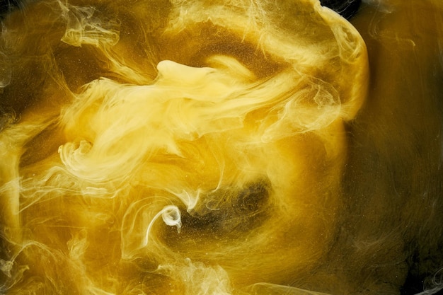 Liquid fluid art abstract background yellow dancing acrylic paints underwater space smoke ocean