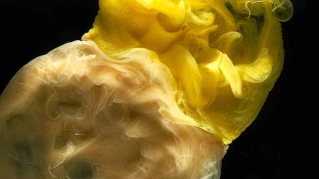 Liquid fluid art abstract background yellow dancing acrylic paints underwater space smoke ocean