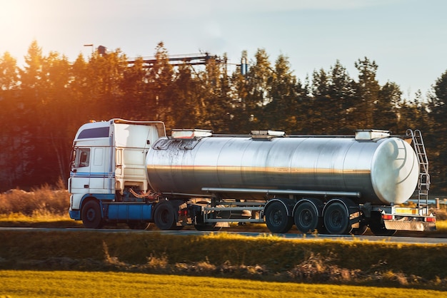 Liquid Fuel and Oil Cargo Semi Truck on the Highway Compressed Gas Carrier Truck in the Evening Light Hauling Petroleum Products Oil Cargo Truck Hauling Petroleum Products