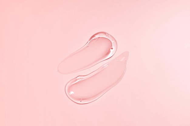 Liquid gel smear isolated on beige background Beauty cosmetic smudge such as pure transparent aloe lotion facial jelly serum cleanser shower gel or shampoo top view