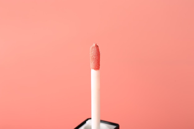 Liquid pink lipstick gloss. cosmetic concept