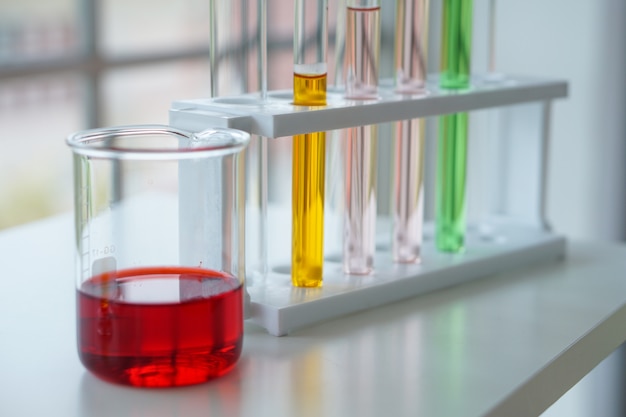 The liquid red,yellow,pink and green are inside laboratories beaker