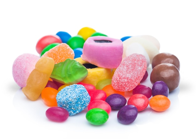 Liquorice Allsorts Sweets with jelly sugar sweets and beans with milk chocolate candies on white background Macro