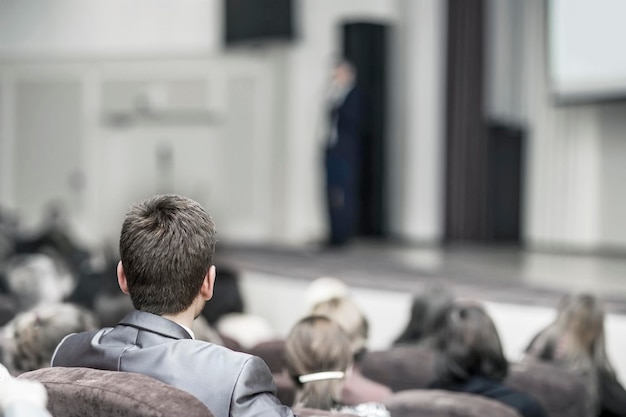 Listeners business courses sitting in lectures in modern conference room