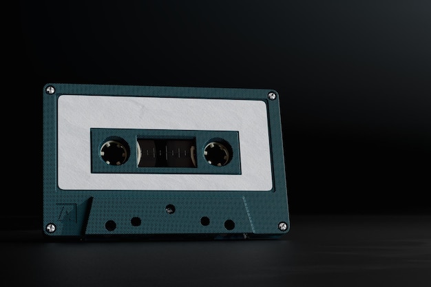 Listening to old music An old black audio cassette on a black background 3D render