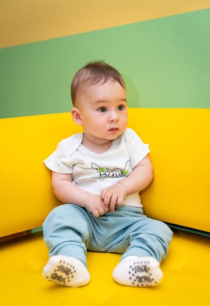 Little adorable baby Portrait of small cute kid lying on the blanket