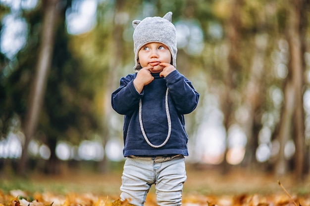 Little baby boy having fun outdoors in the park