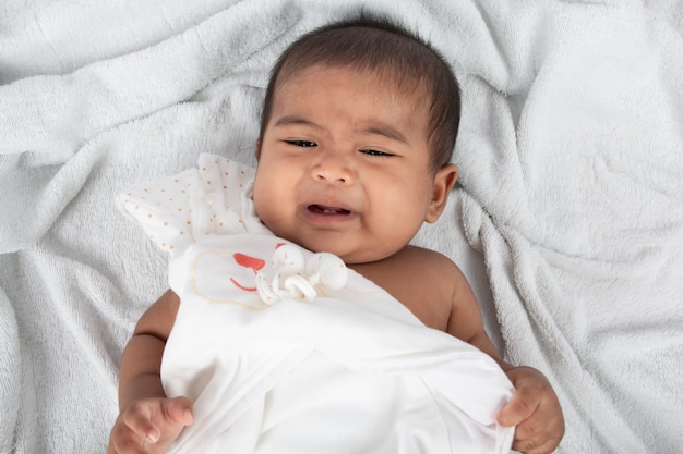 Little baby boy lying on soft towel