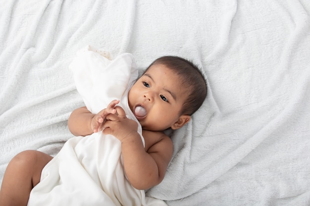 Little baby boy lying on soft towel