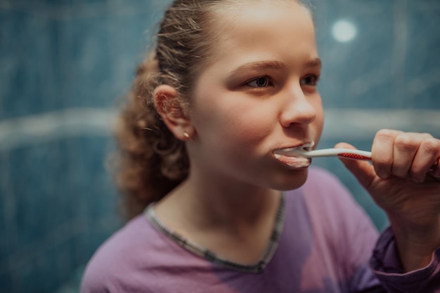 Little beautiful girl brushing teeth healthy concept