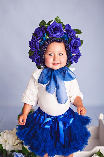 Little beautiful girl in costume Flower studio shot