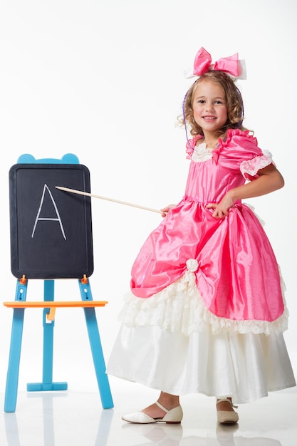 Little Beauty Queen Young girl as magic fairy on white background