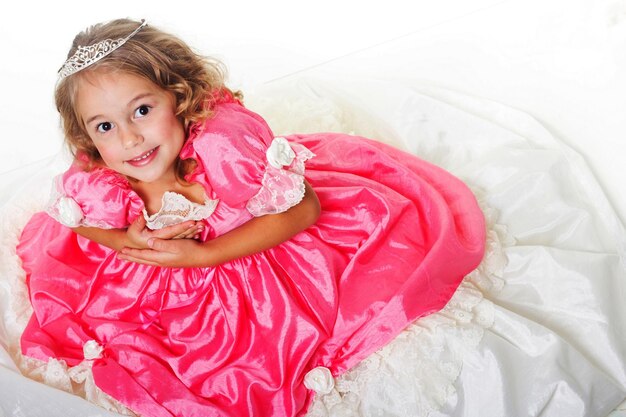 Little Beauty Queen Young girl as magic fairy on white background