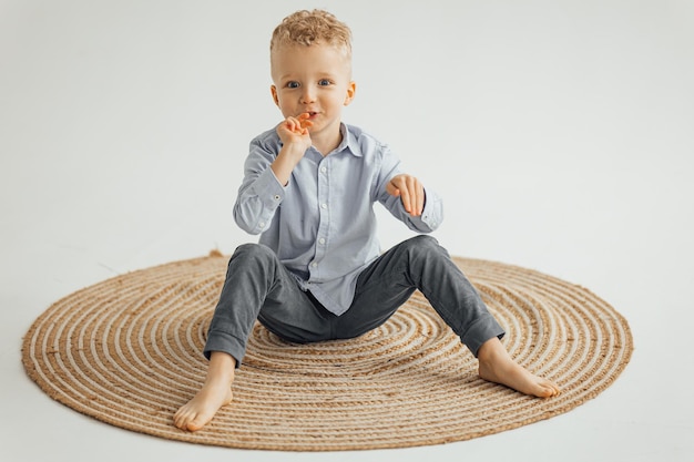 Little boy 4 years old blond in a shirt