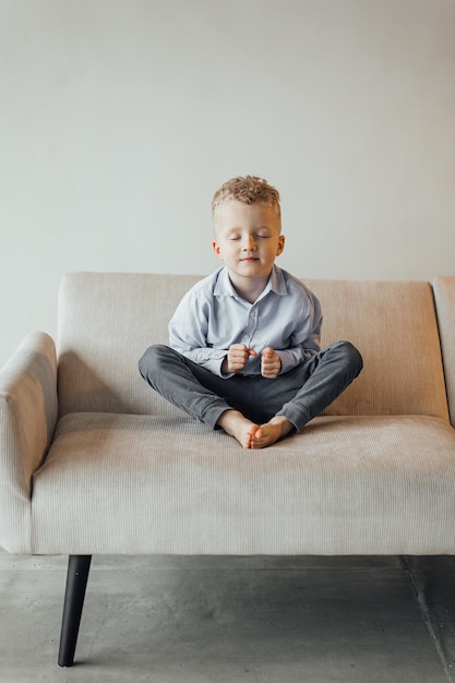 Little boy 4 years old blond in a shirt