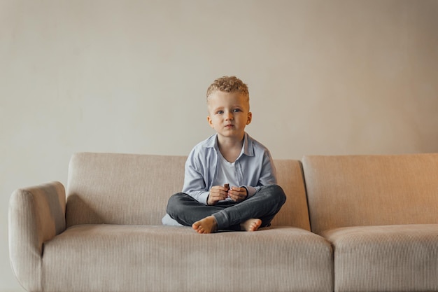 Little boy 4 years old blond in a shirt