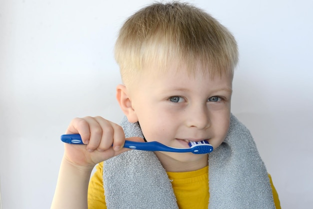 little boy brushing his teeth