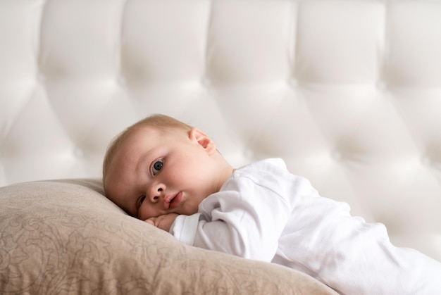 a little boy. the child is lying . baby on a white background