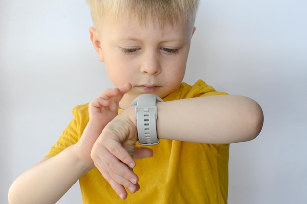 little boy enjoys a smart watch