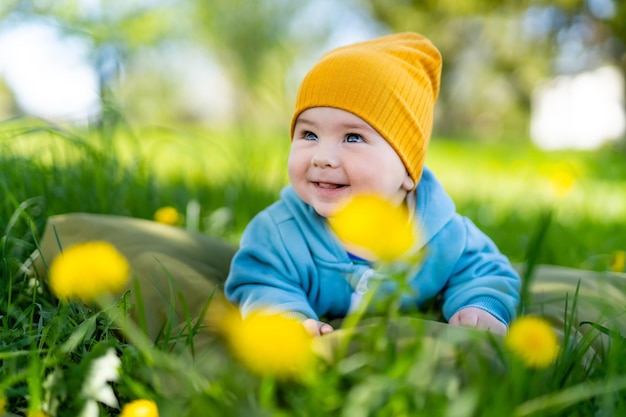 Little boy in flowers field Beautiful child portrait outdoors Baby boy exploring nature