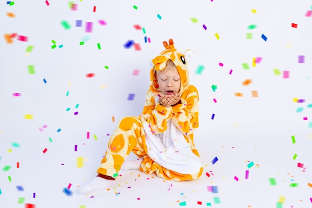 Little boy in a funny costume on a white isolated background