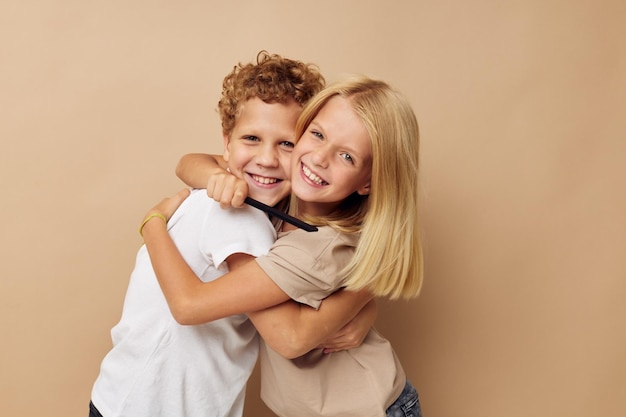 Little boy and girl posing with a comb isolated background