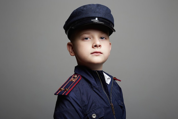 Little boy in hat and uniform Police child