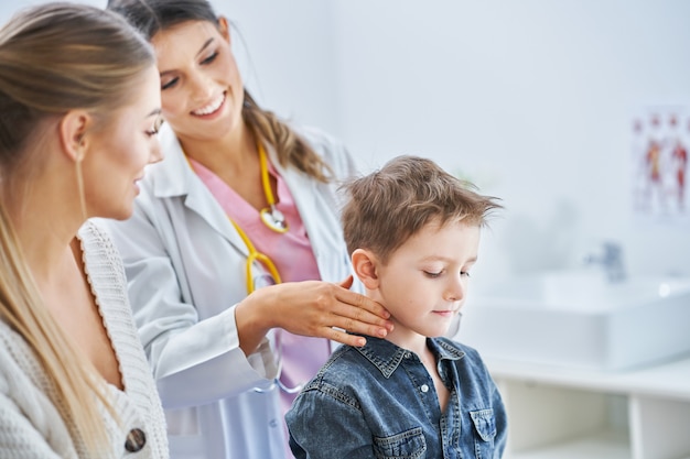 little boy having medical examination by pediatrician