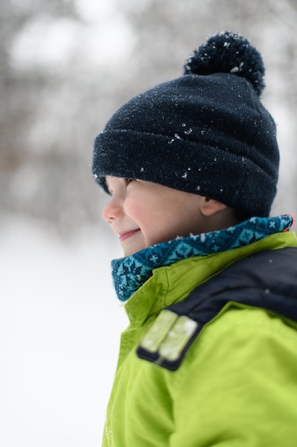 Little Boy is Having Fun Playing With Snow