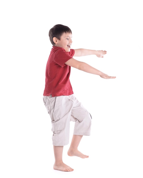 Little boy is preparing to perform morning gymnasticsisolated on white