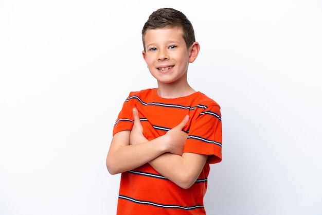 Little boy isolated on white background with arms crossed and looking forward