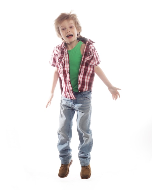 Little boy jumping on isolated white background