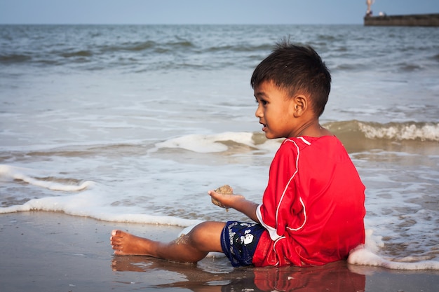 Little boy play at the beach