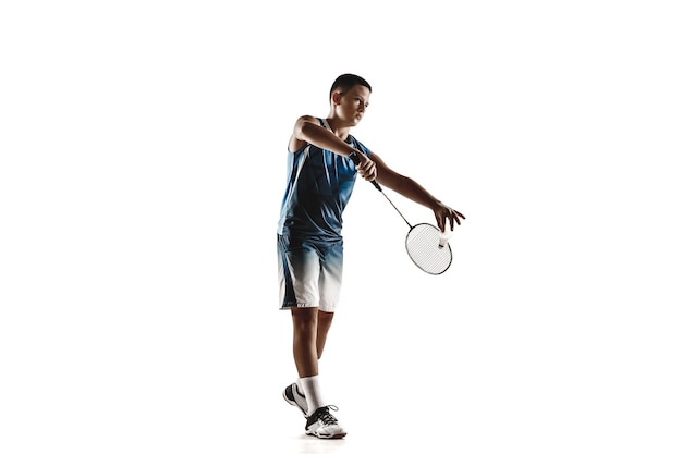 Little boy playing badminton isolated on white  wall