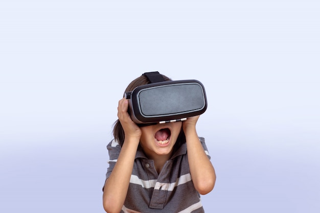 Little boy playing video games with VR.