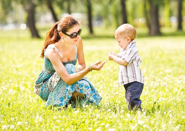 Little boy playing with mother in the park