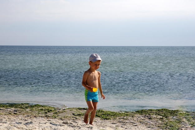 Little boy on the sea beach