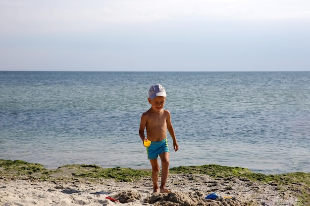 Little boy on the sea beach