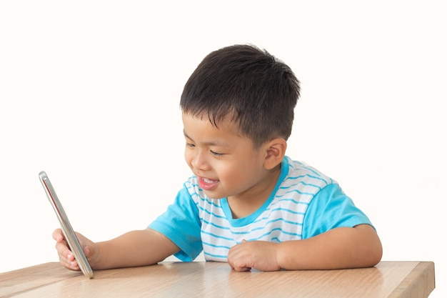 little boy selfie on wooden table and white background,