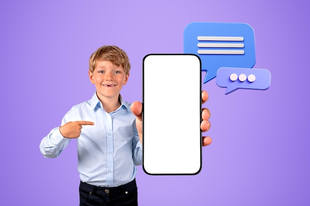 Little boy showing blank smartphone screen