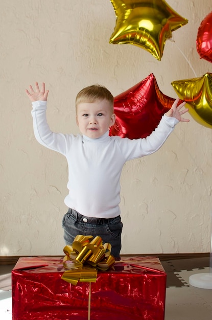 Little Boy Surprised by big Birthday Gift box